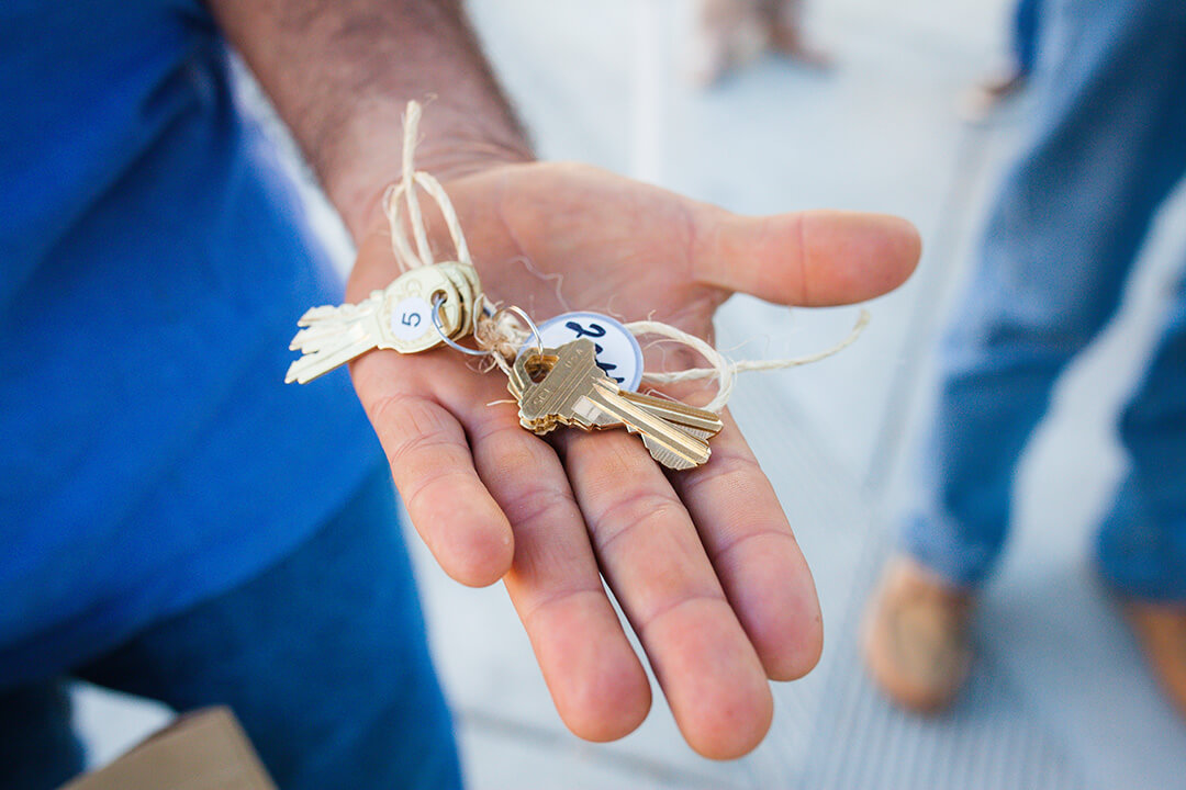 up close photo of keys in a person's hand